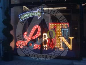 Visual Merchandising Signage Louboutin Neon Graveyard